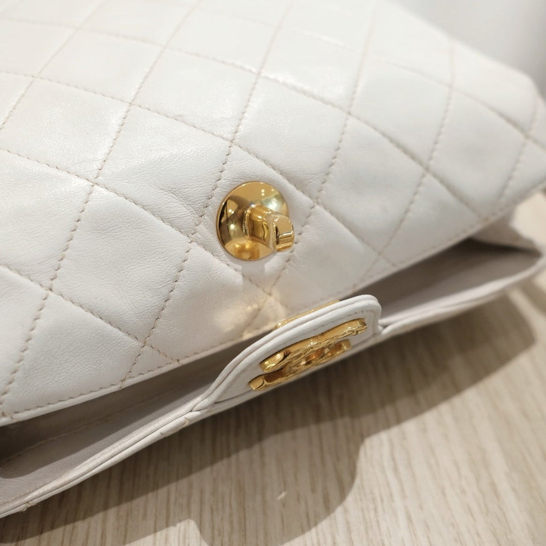Chanel vintage diamond logo post bag