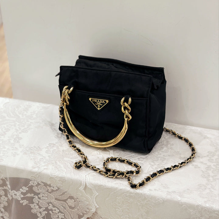 Prada vintage nylon bag with gold handle