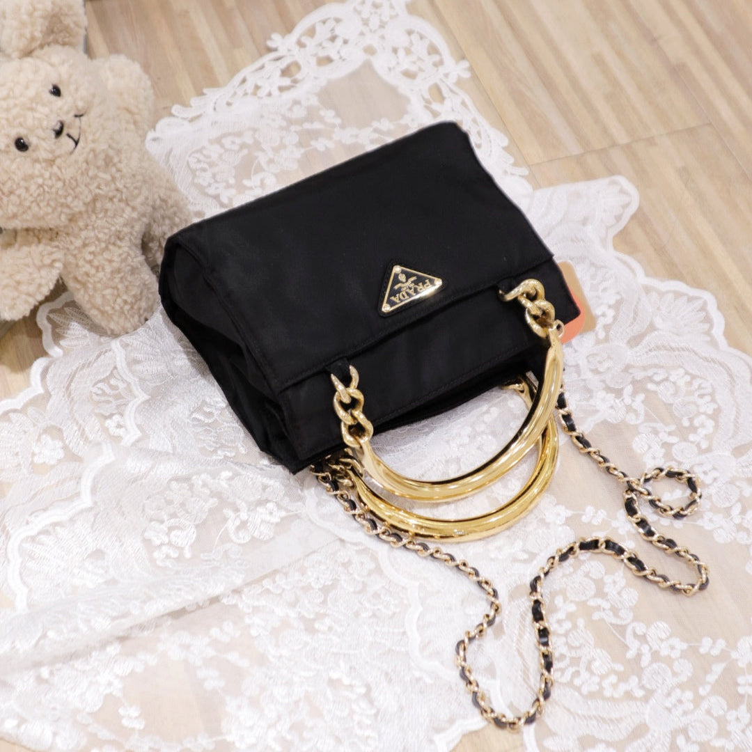 Prada vintage nylon bag with gold handle