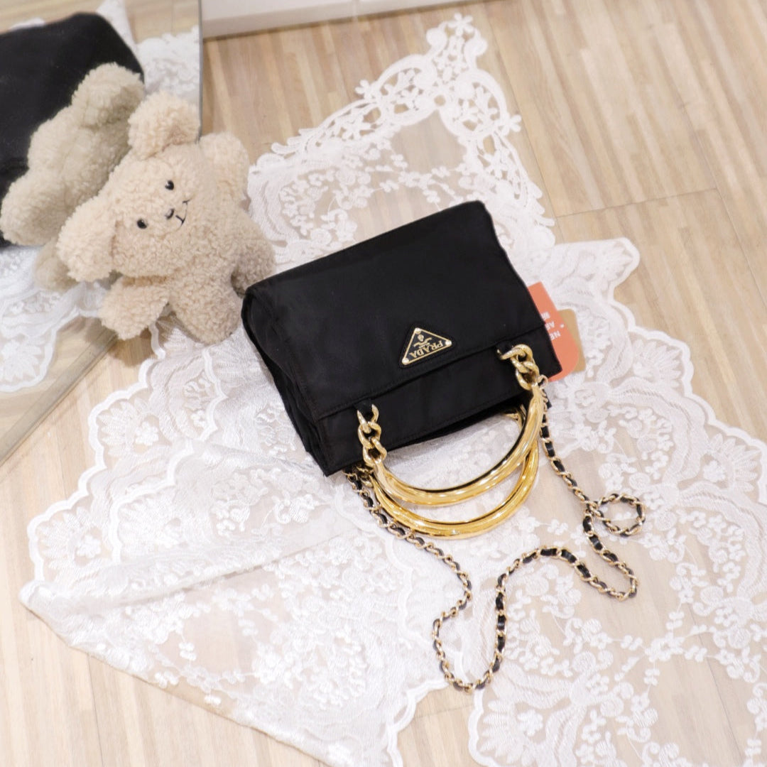 Prada vintage nylon bag with gold handle