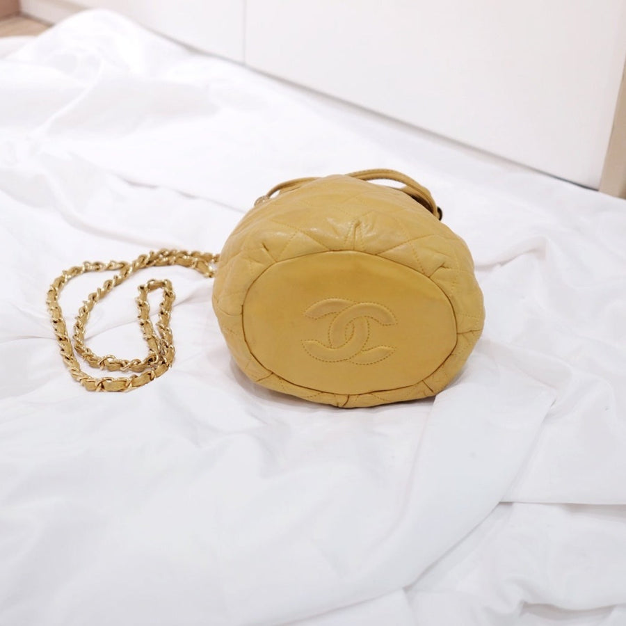 Chanel quilted drawstring chain bag