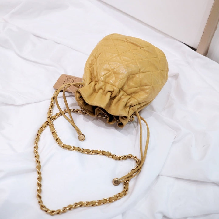 Chanel quilted drawstring chain bag