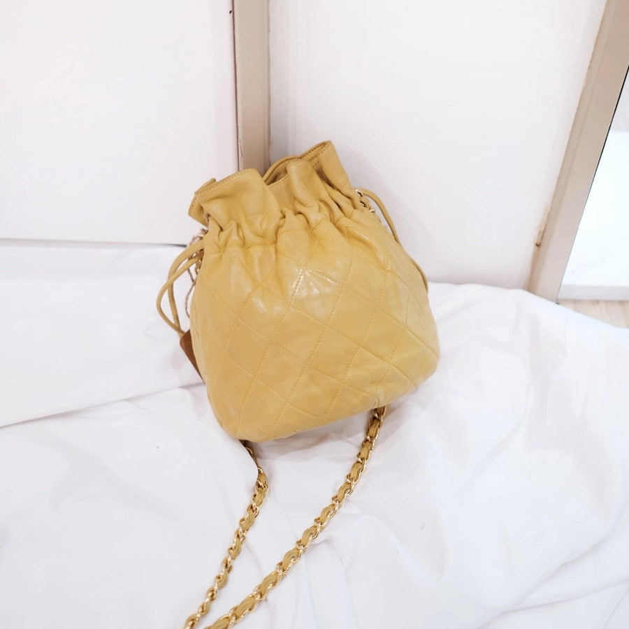 Chanel quilted drawstring chain bag