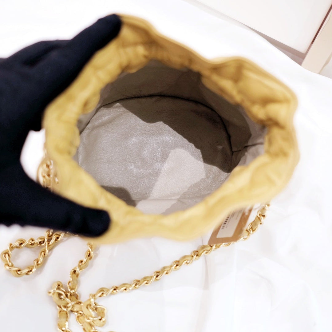Chanel quilted drawstring chain bag