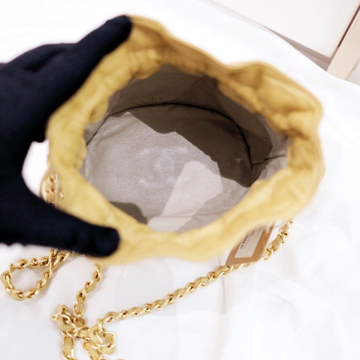 Chanel quilted drawstring chain bag