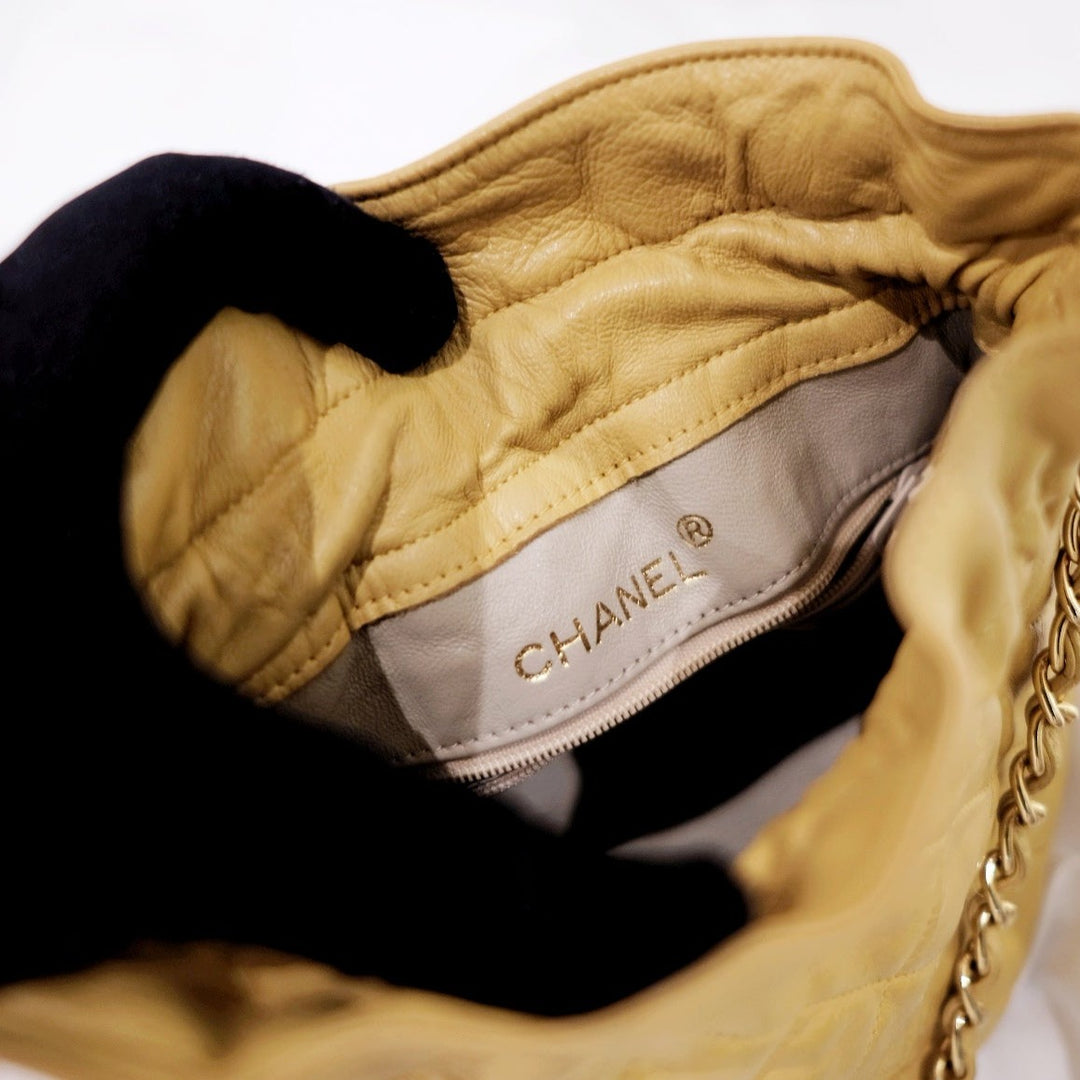 Chanel quilted drawstring chain bag