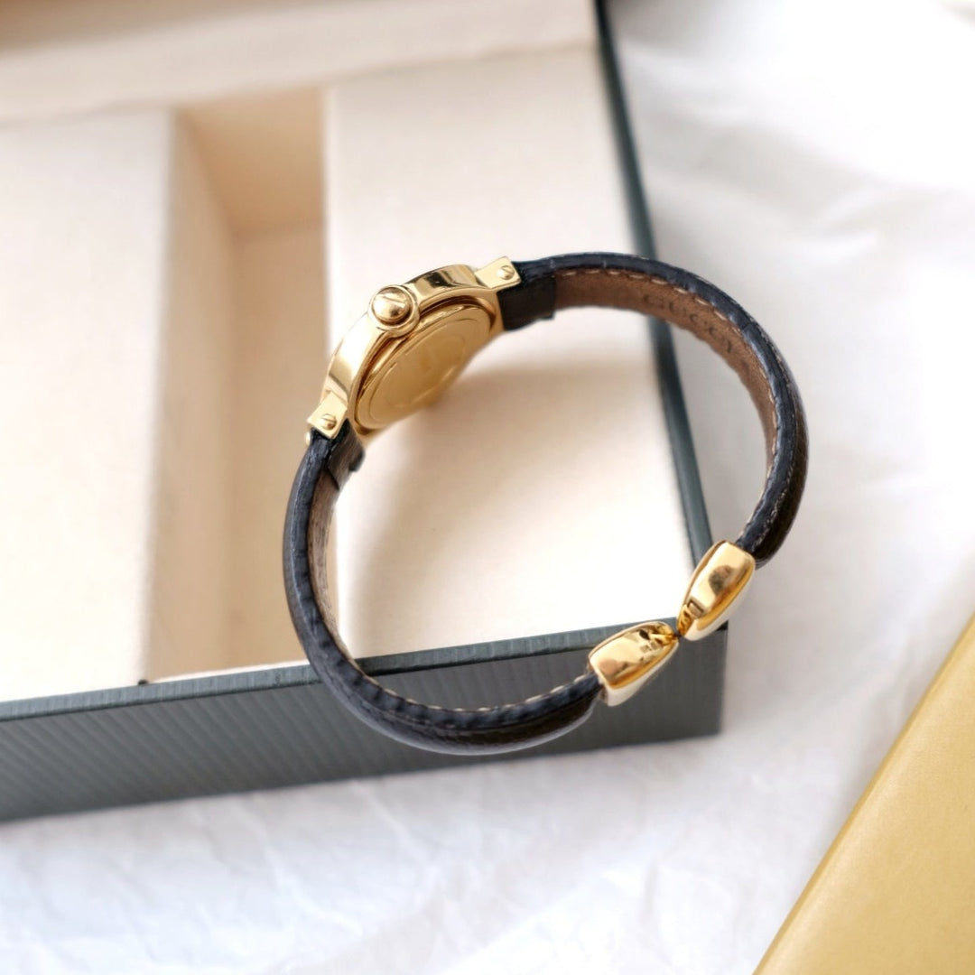 Gucci vintage gold swivel-twirl wristwatch