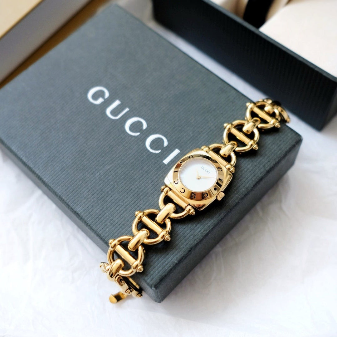 Gucci vintage 6400L mother pearl dial & horsebit chain watch