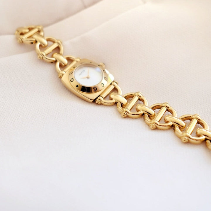 Gucci vintage 6400L mother pearl dial & horsebit chain watch
