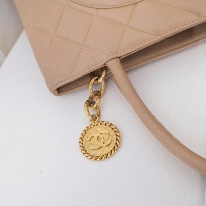 Chanel medallion beige tote bag